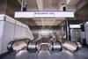 The top of the escalators at the new Farringdon Station with a sign saying Elizabeth Line